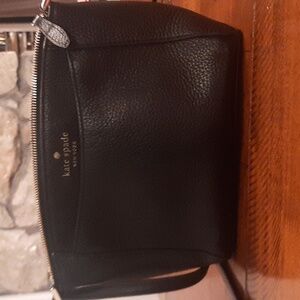 Kate Spade black cross body pocketbook.